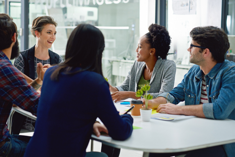 A group of people working together at a table.
