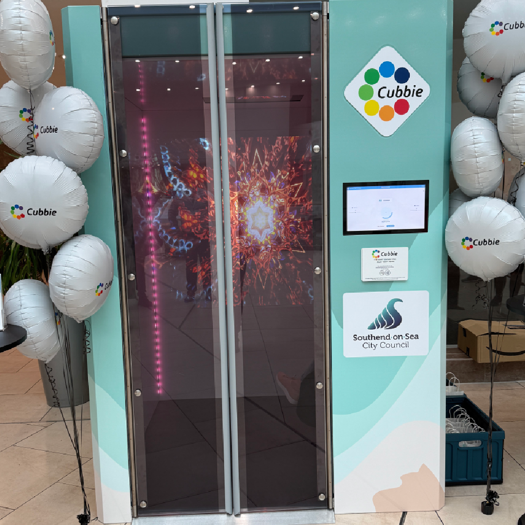 Photograph of the cubbie in the victoria centre. It shows a tall booth that you can sit in with the cubbie and Southend Council logo on it surrounded by balloons.