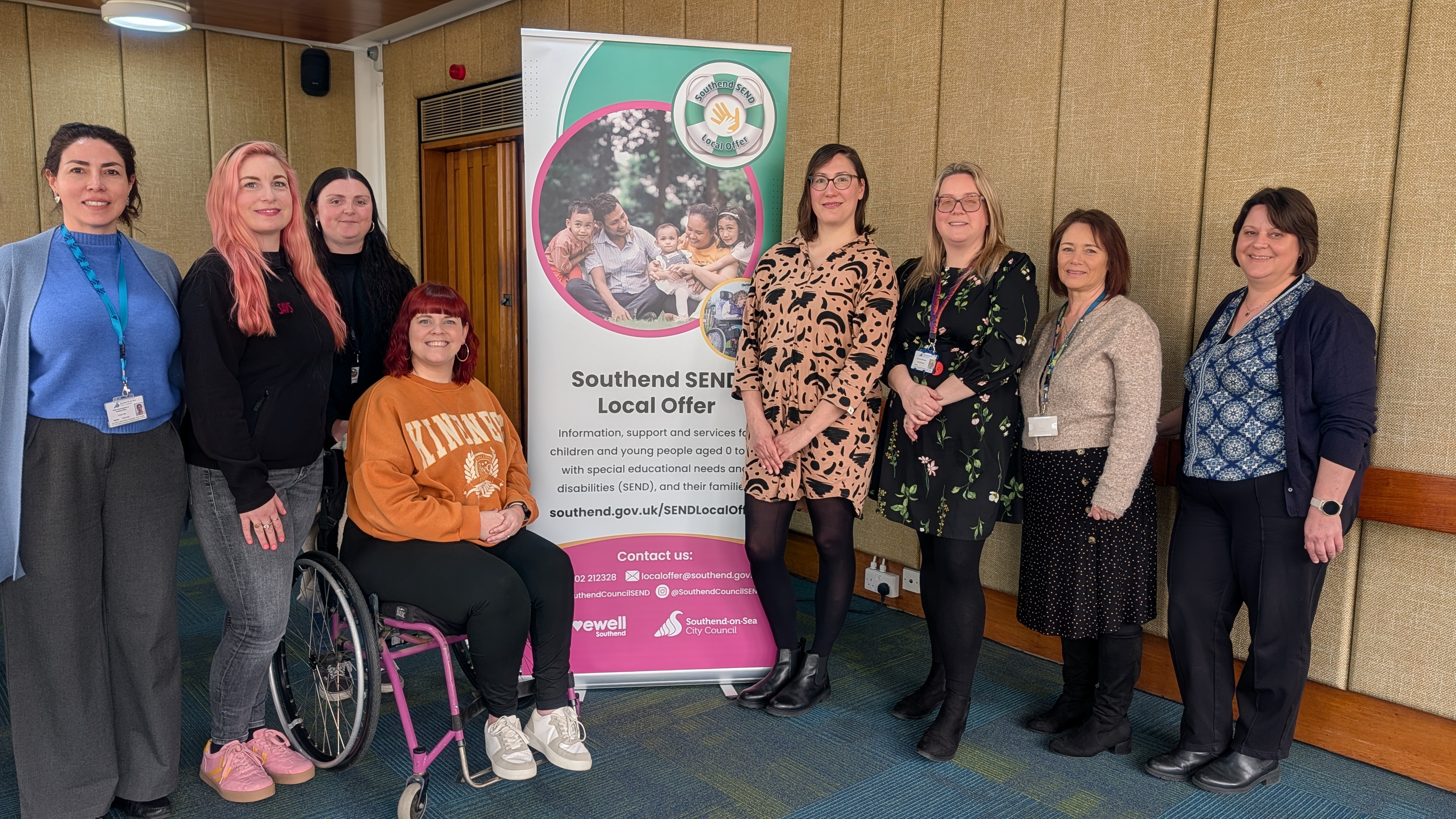 Photograph of a group of SAVS parent Voice Ambassadors and members of the SEND Local Offer Team and early years SEND Team. The group are gathered around the SEND Local Offer banner, smiling.