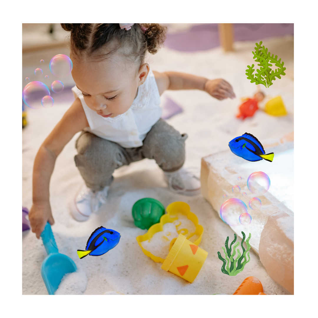 A child playing on a sandpit. There are fish, algae and bubbles graphics on the photo