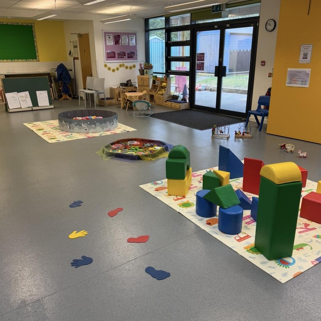 Inside a Best Start Family Hub with toys and activities set up for young children.