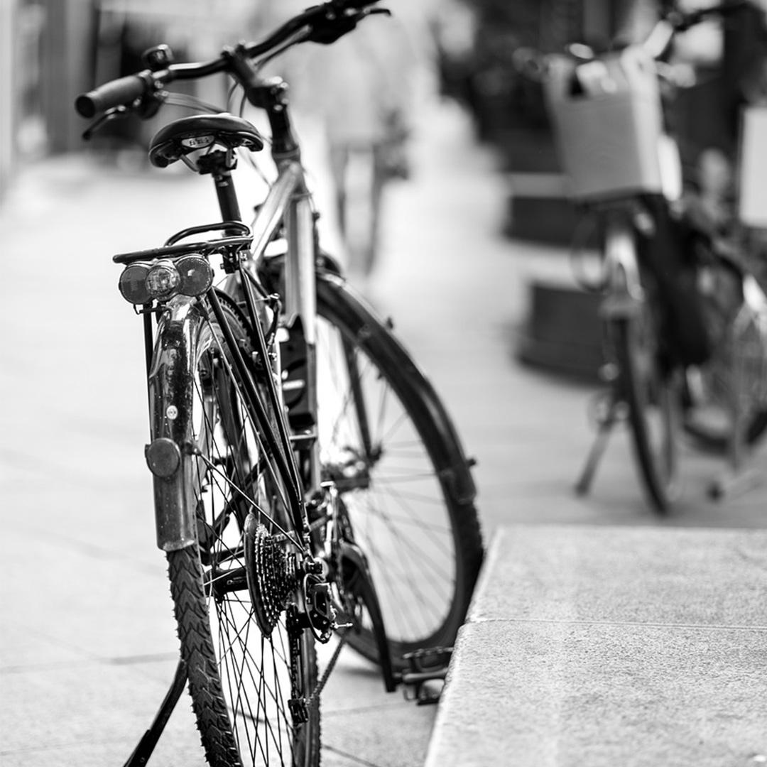 Black and white image of a mountain bike with the kickstand down
