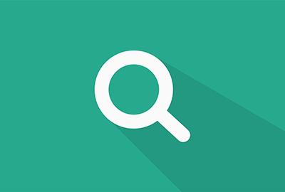 Magnifying glass on green background